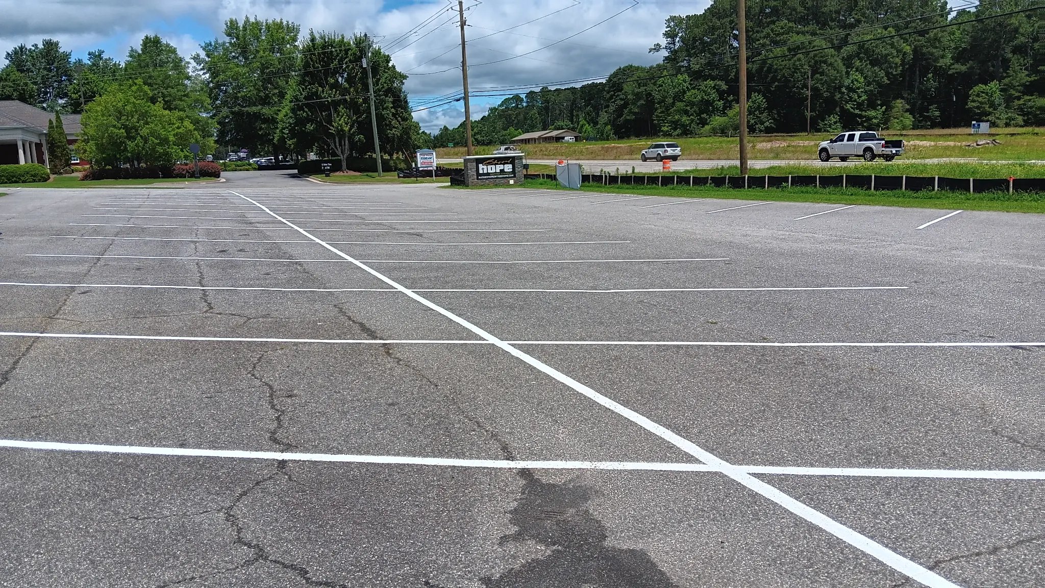 Fresh white parking space striping at a North & Middle Georgia commercial property.